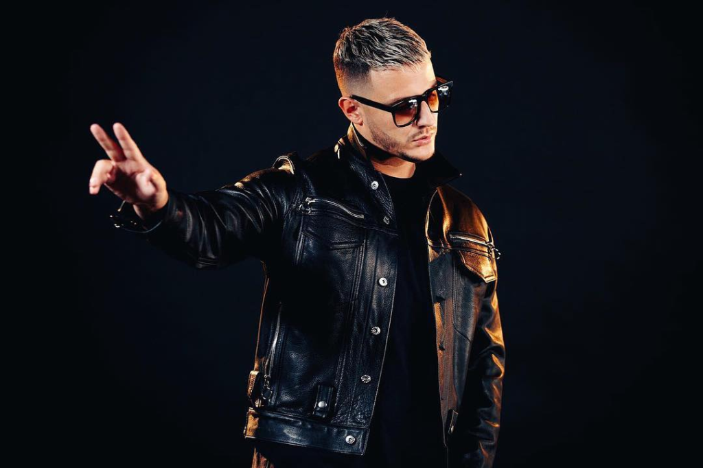 DJ Snake performing live with an electrifying crowd at Coca-Cola Arena, Dubai