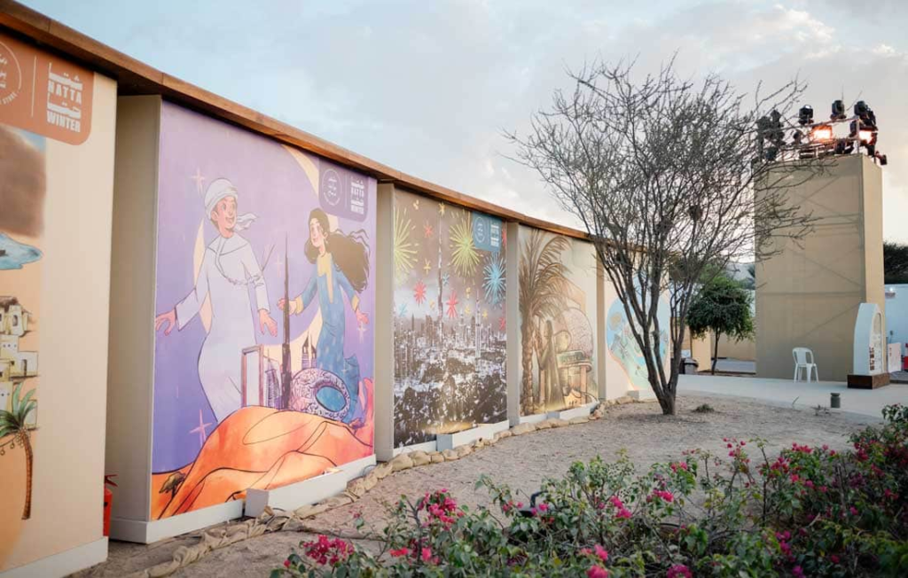 Visitors enjoying Hatta Winter festivities around Leem Lake with mountains in the backdrop