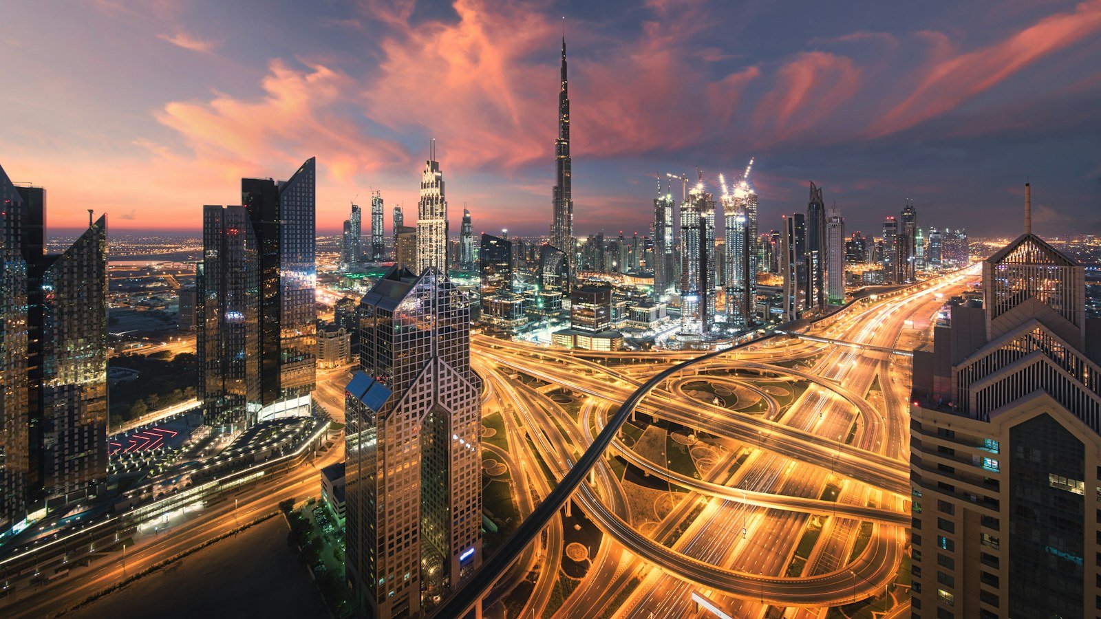 Dubai skyline and Sheikh Zayed Road interchange at sunset, UAE driving guide