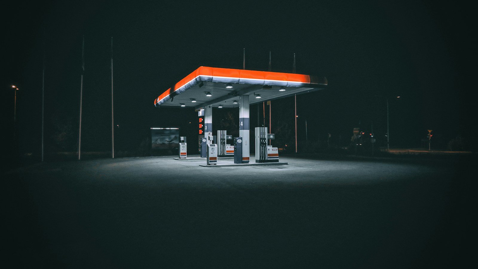 Petrol station lit up at night, UAE petrol prices